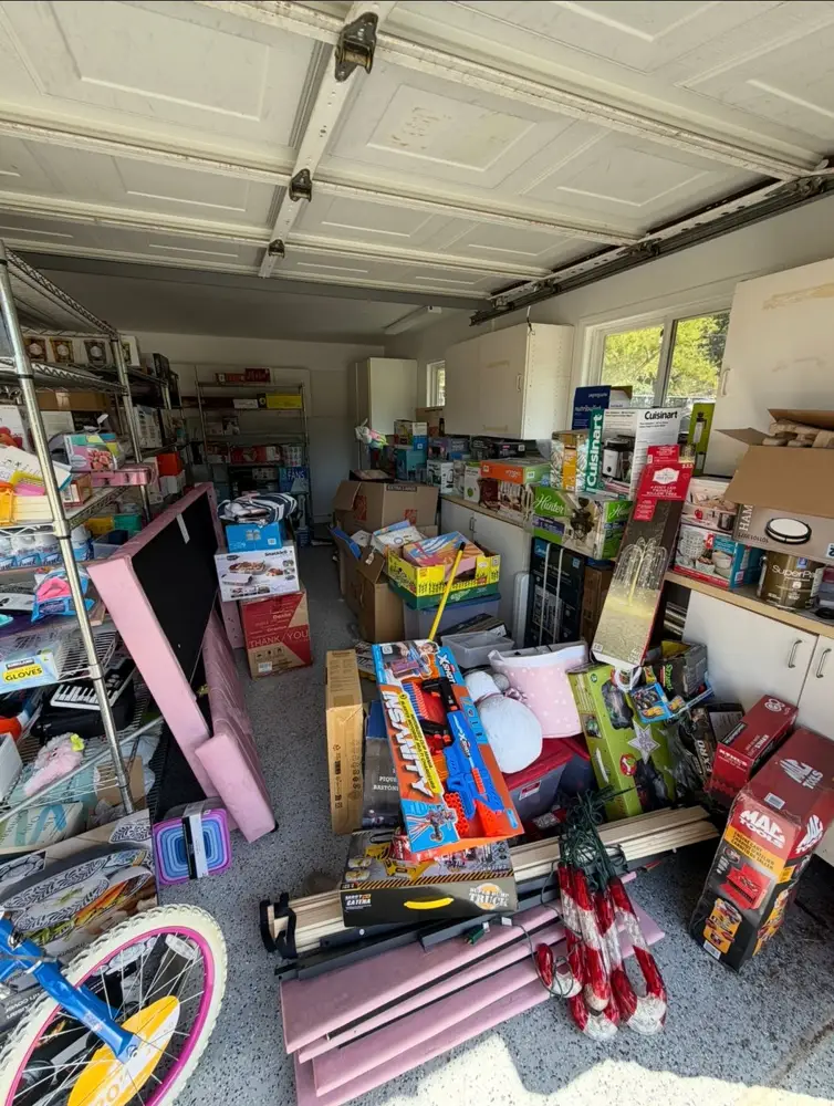 Cluttered garage before a cleanout